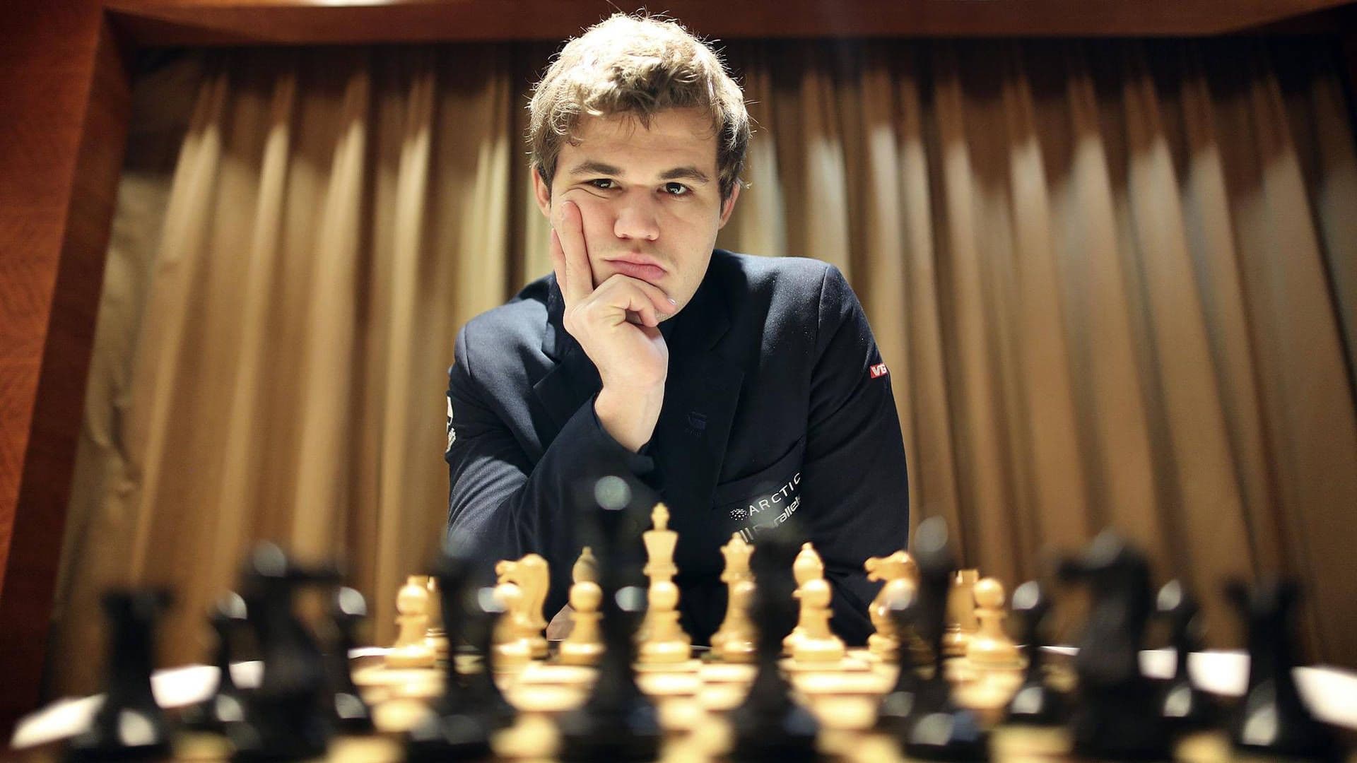 Magnus Carlsen Looking At Chess Board